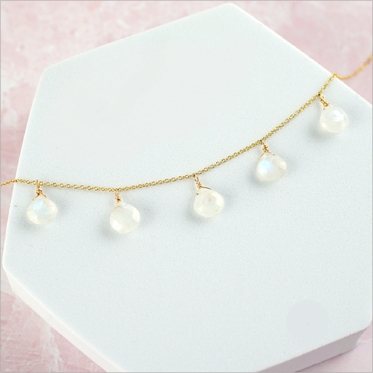 Rainbow Moonstone Necklace with pink background